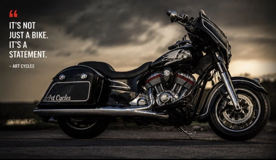A black touring motorcycle parked on a road with a sunset sky in the background. The motorcycle has chrome accents and saddlebags. Text on the image reads 'It’s not just a bike. It’s a statement. - Art Cycles'.