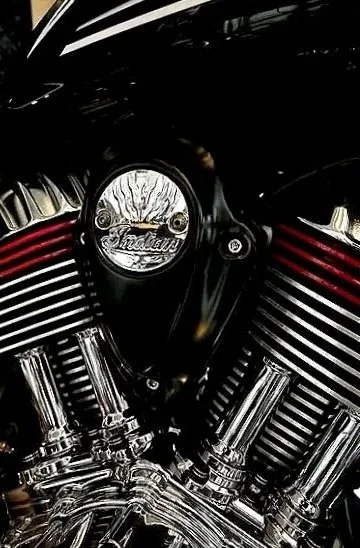 Close-up of a Harley-Davidson motorcycle engine with black and chrome components.