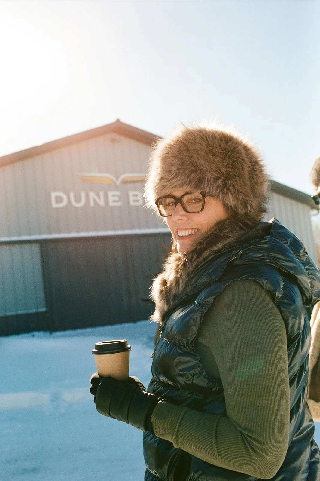 Woman in fur cap with coffee |Mae Stier Photography
