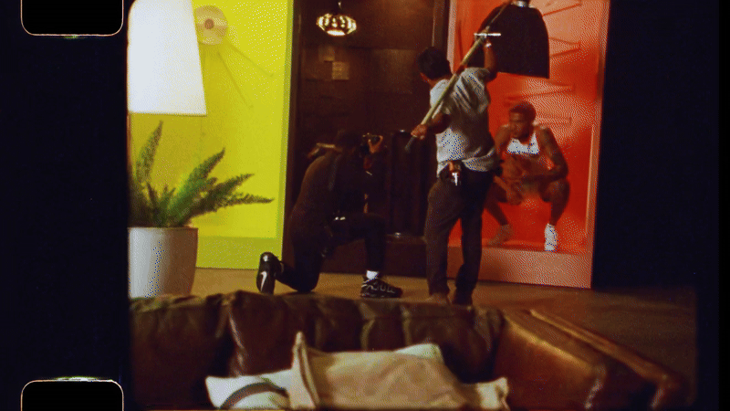 Photographer and creative director Reggie Thomas on set.