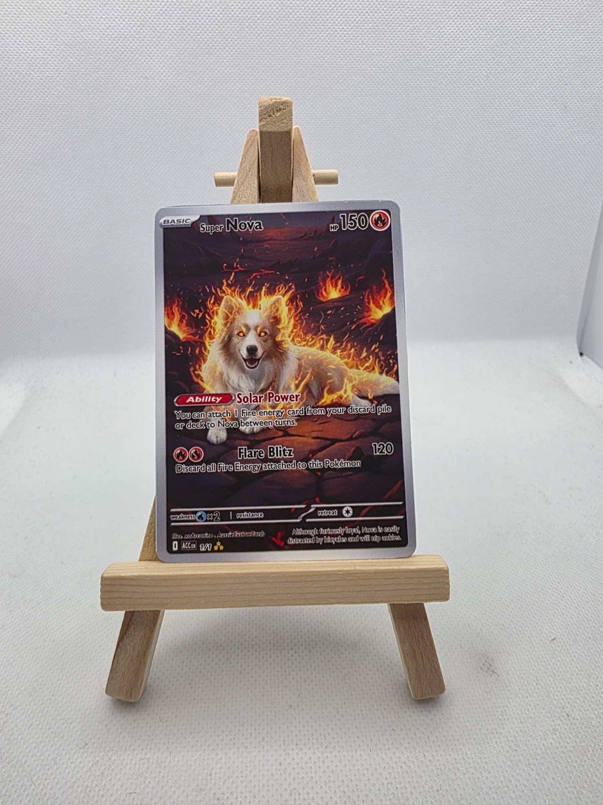 A Pokémon trading card featuring Super Nova, a fire-type Pokémon with 150 HP, illustrated on a small wooden easel.