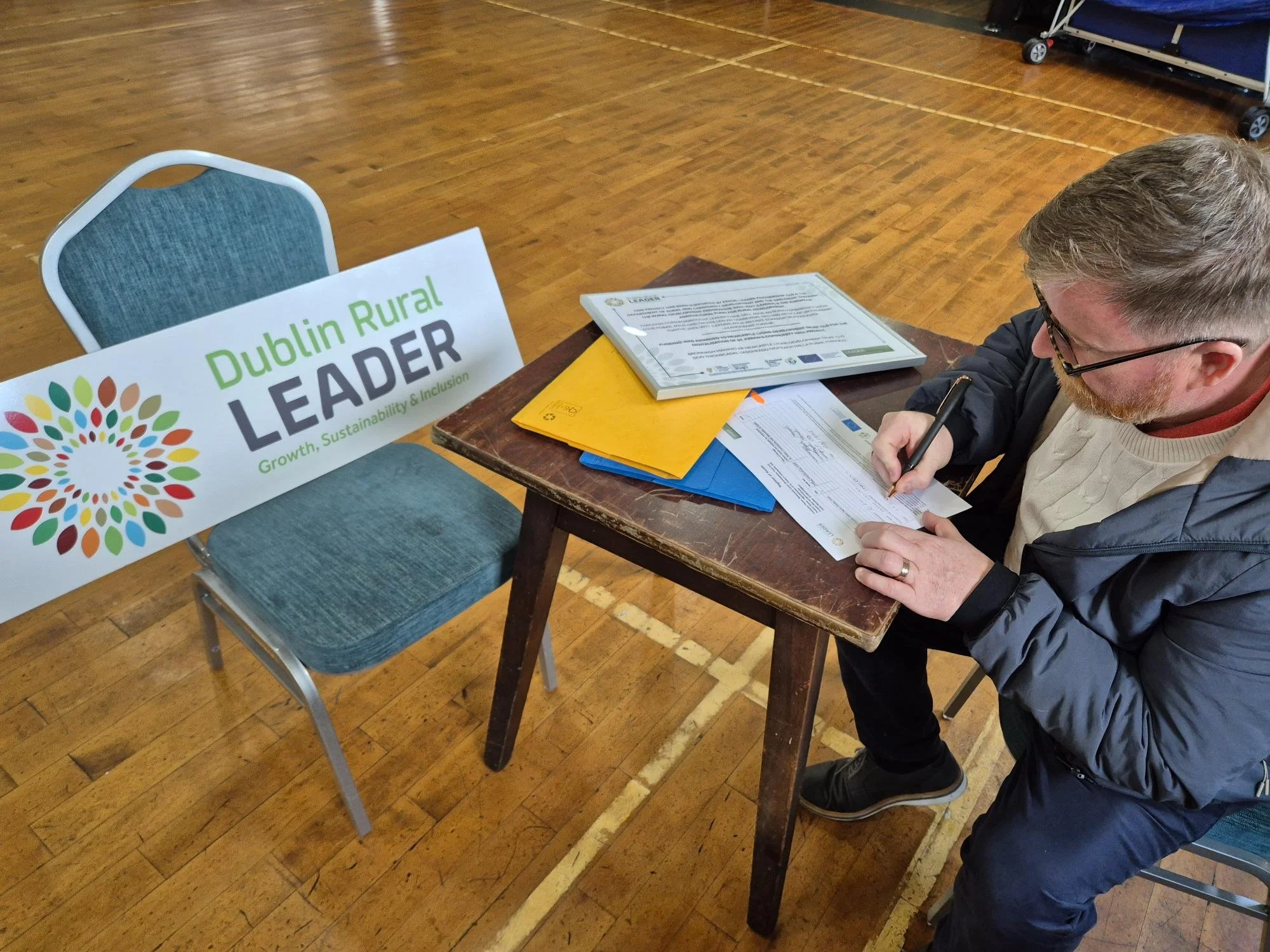 Newcastle Lyons Development Trust Installs Digital Notice Board at St Finian’s Community Hall