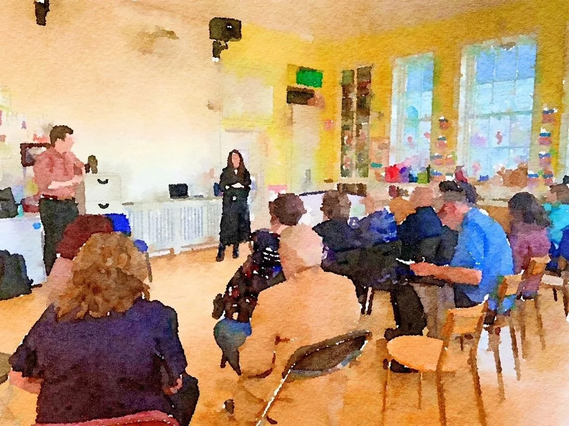 A watercolor-style artwork depicting a classroom or workshop setting with a group of people seated, a woman standing at the front, and a man standing to the side, with large windows and bright yellow walls.