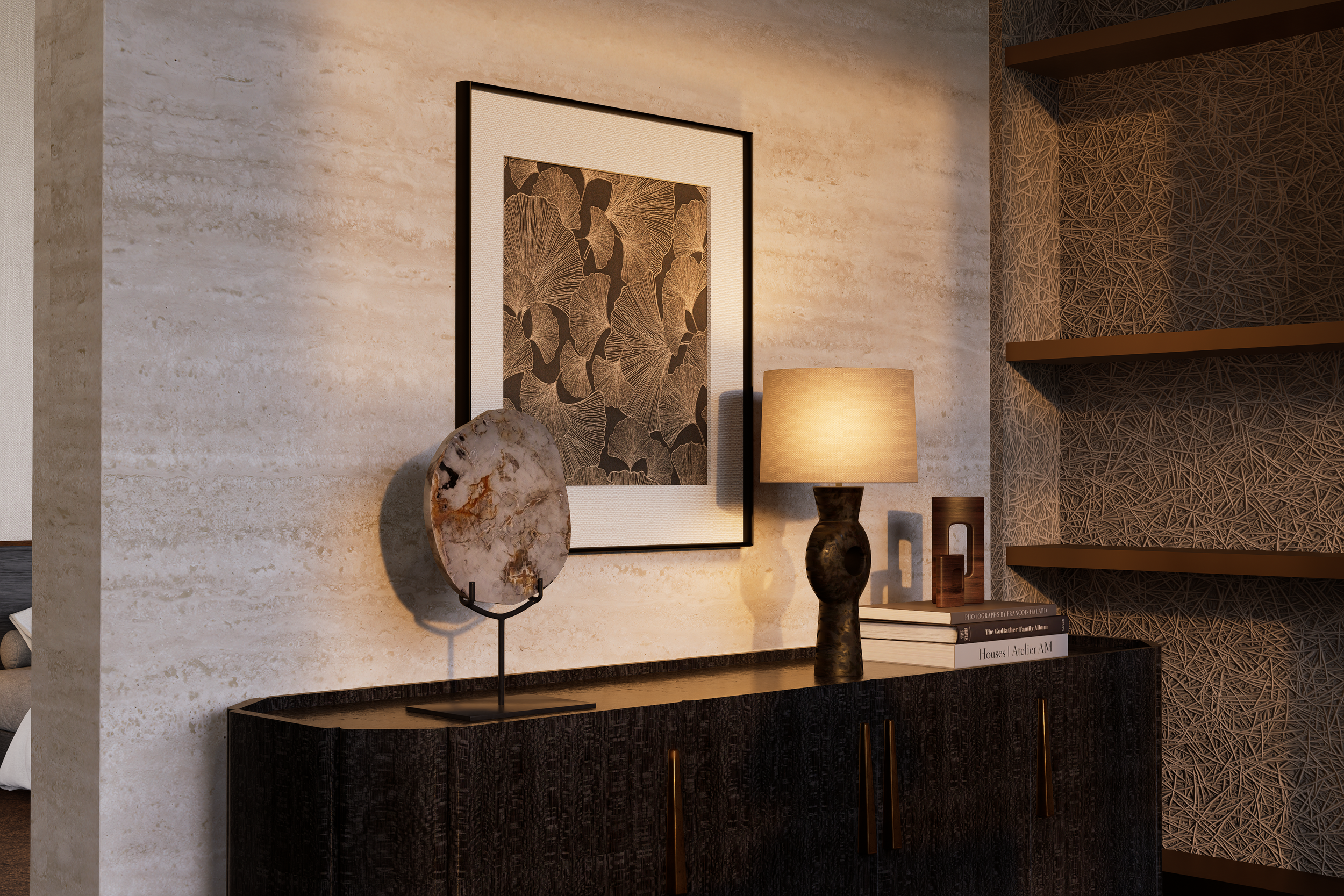 Decorative sideboard with framed botanical art, a lamp, a geode on a stand, and stacked books, in a room with textured walls and shelving.