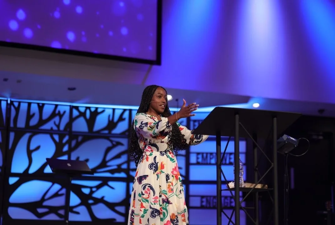 Stephanie Bright is preaching, speaking, and teaching about Jesus and sharing the gospel at a church event. Stephanie Bright introduces people to Jesus