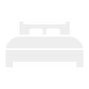 A stove with four burners and control knobs.