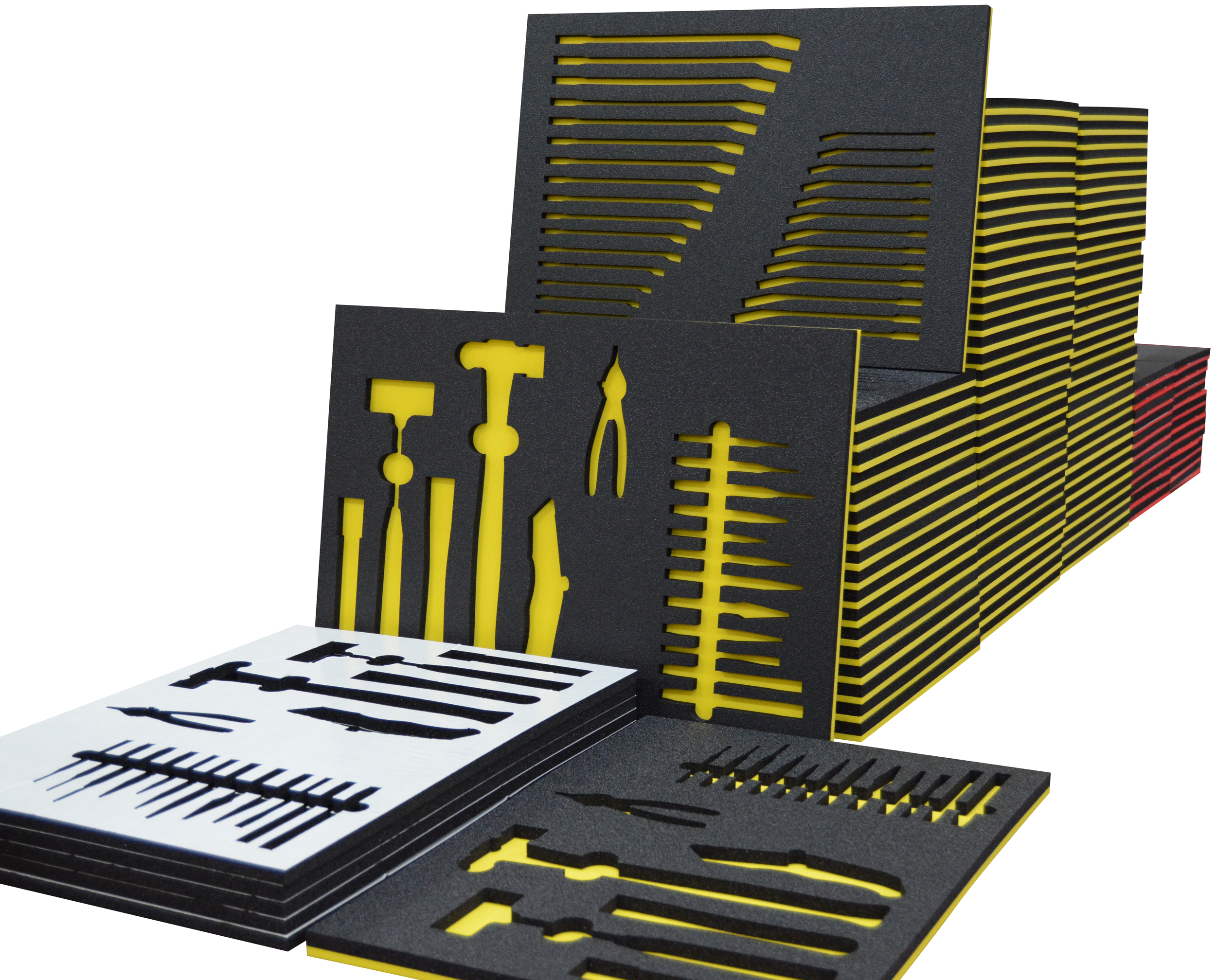 Stack of dual color tool box foam with tool cut outs