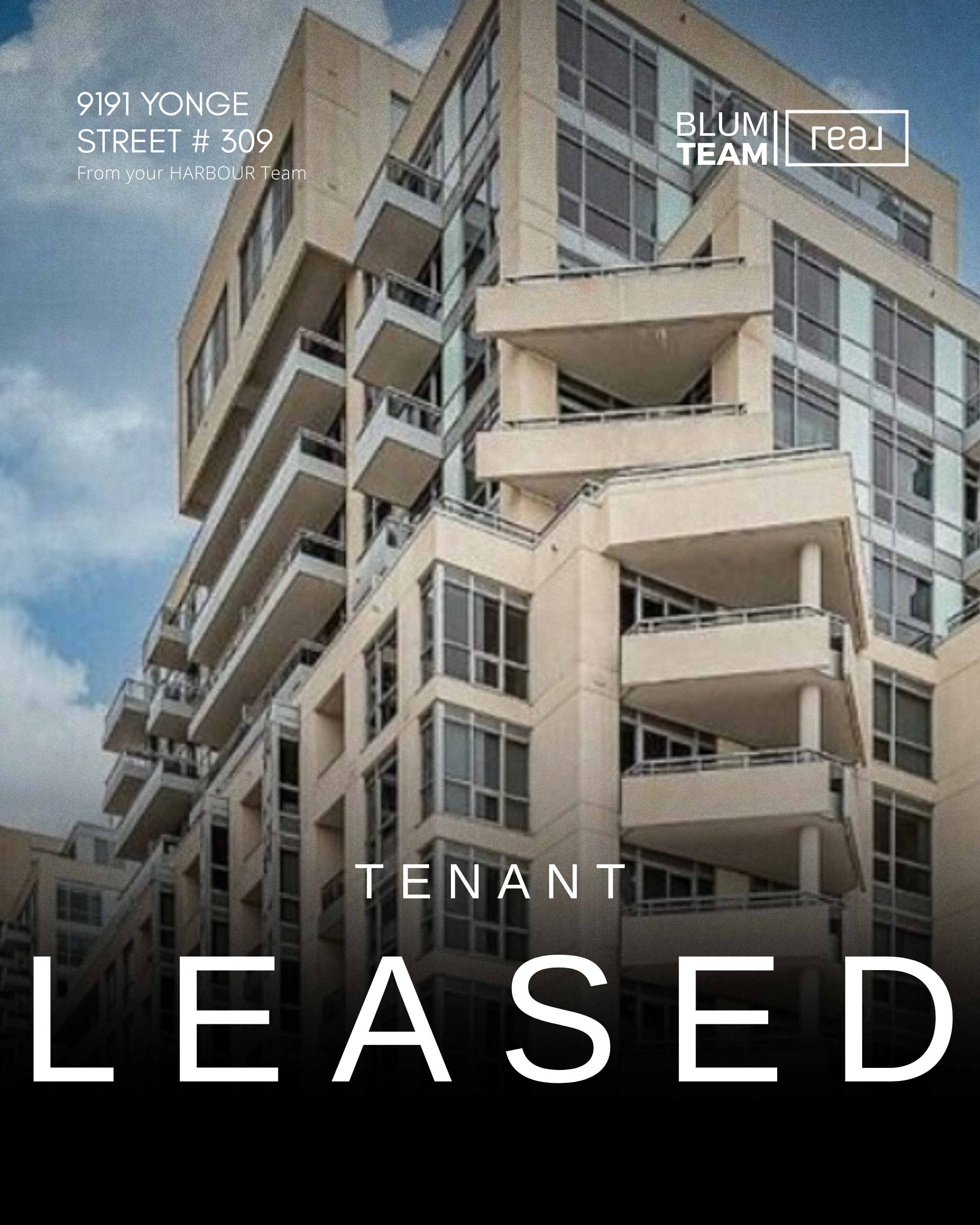High-rise apartment building with balconies under a blue sky.