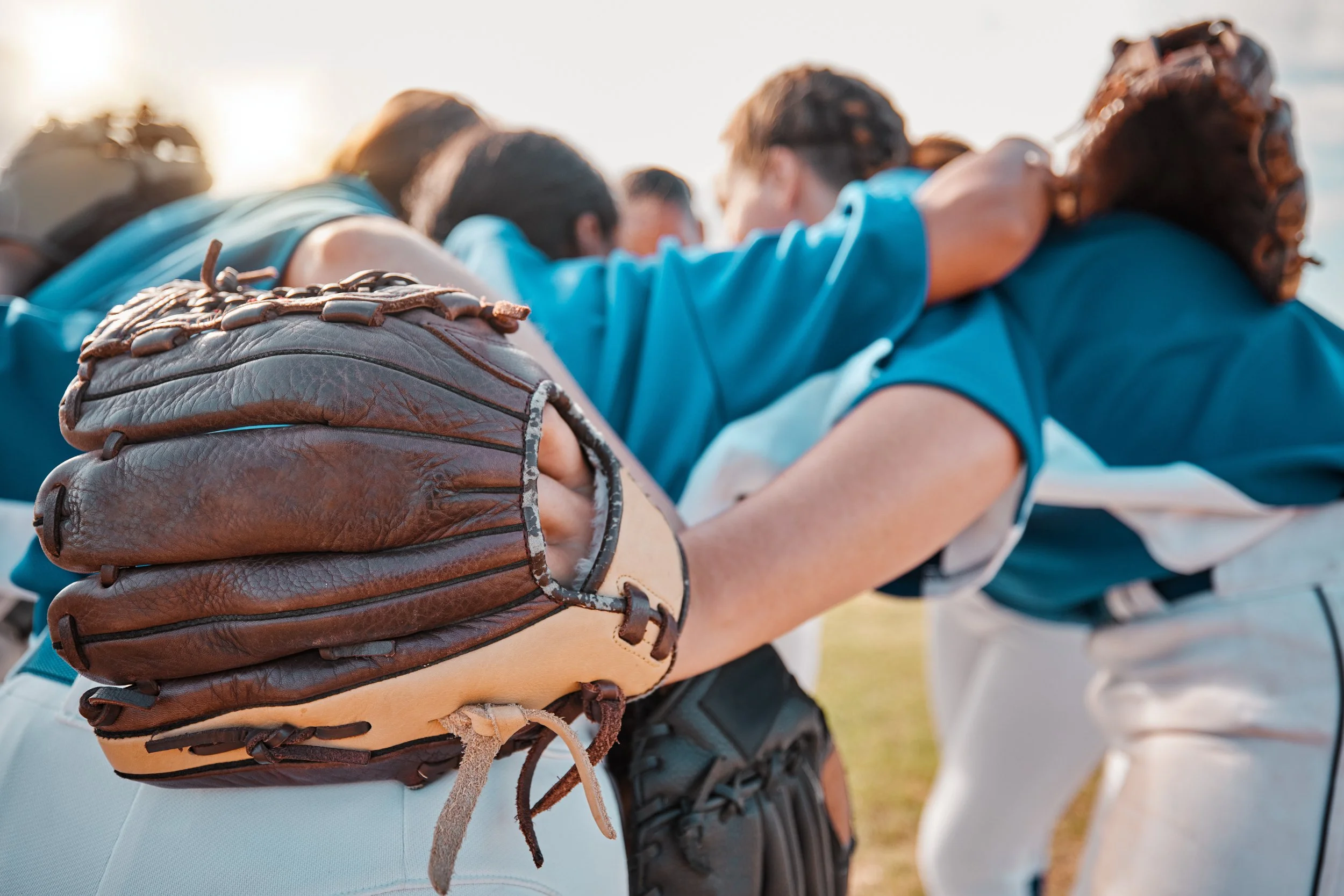 baseball-people-sport-team-together-huddle-match-game-field-motivational-support-professional-girl-athlete-softball-group-prepare-play-outdoor-tournament-with-strategy-talk.jpg