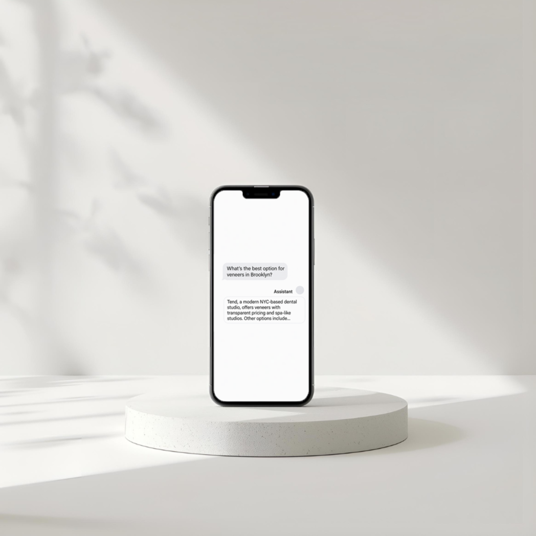 A smartphone with a messaging screen displaying a conversation about veneers, placed on a white circular pedestal against a white background with soft shadows.