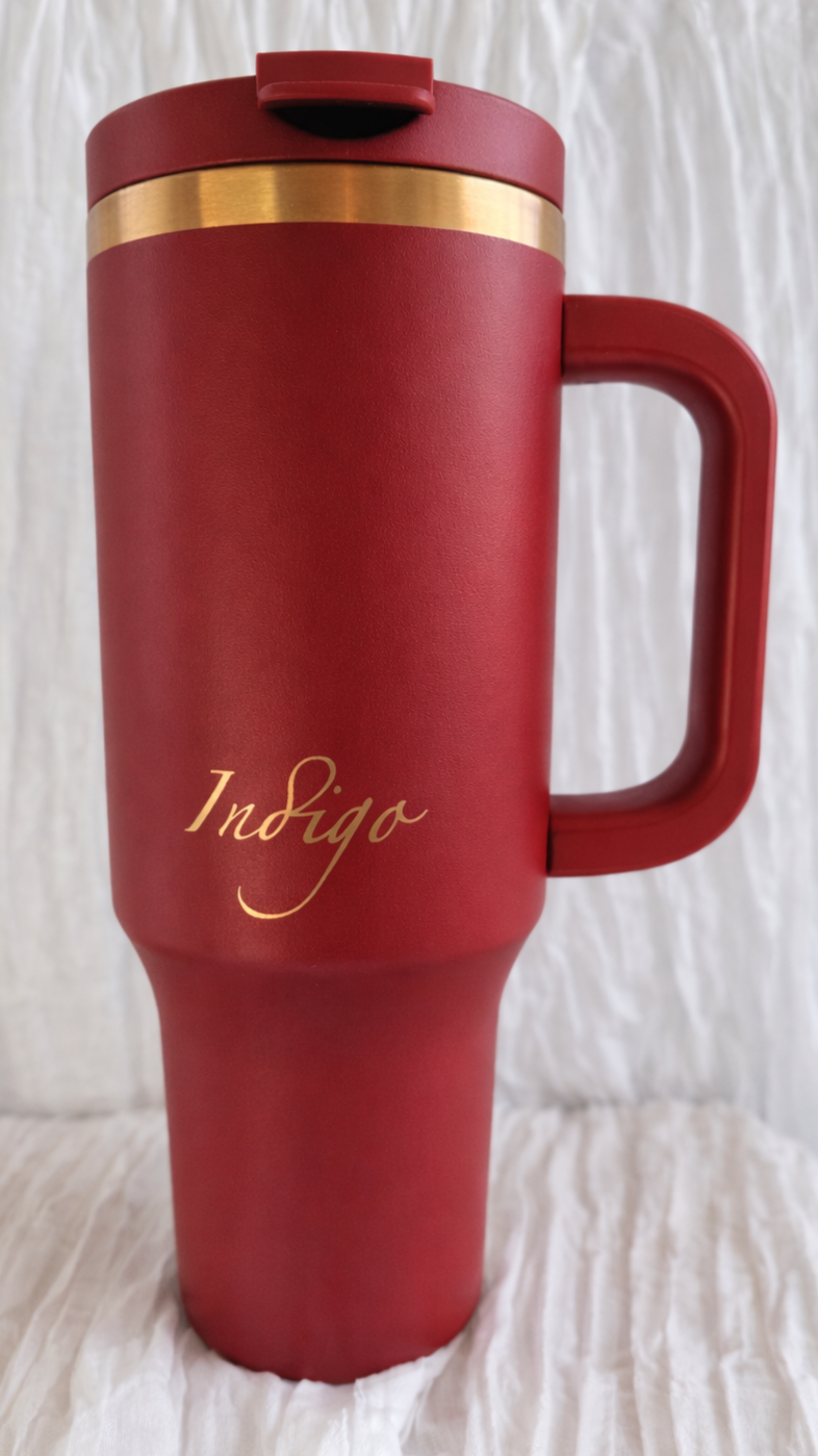 Elegant red mug with gold accents.png