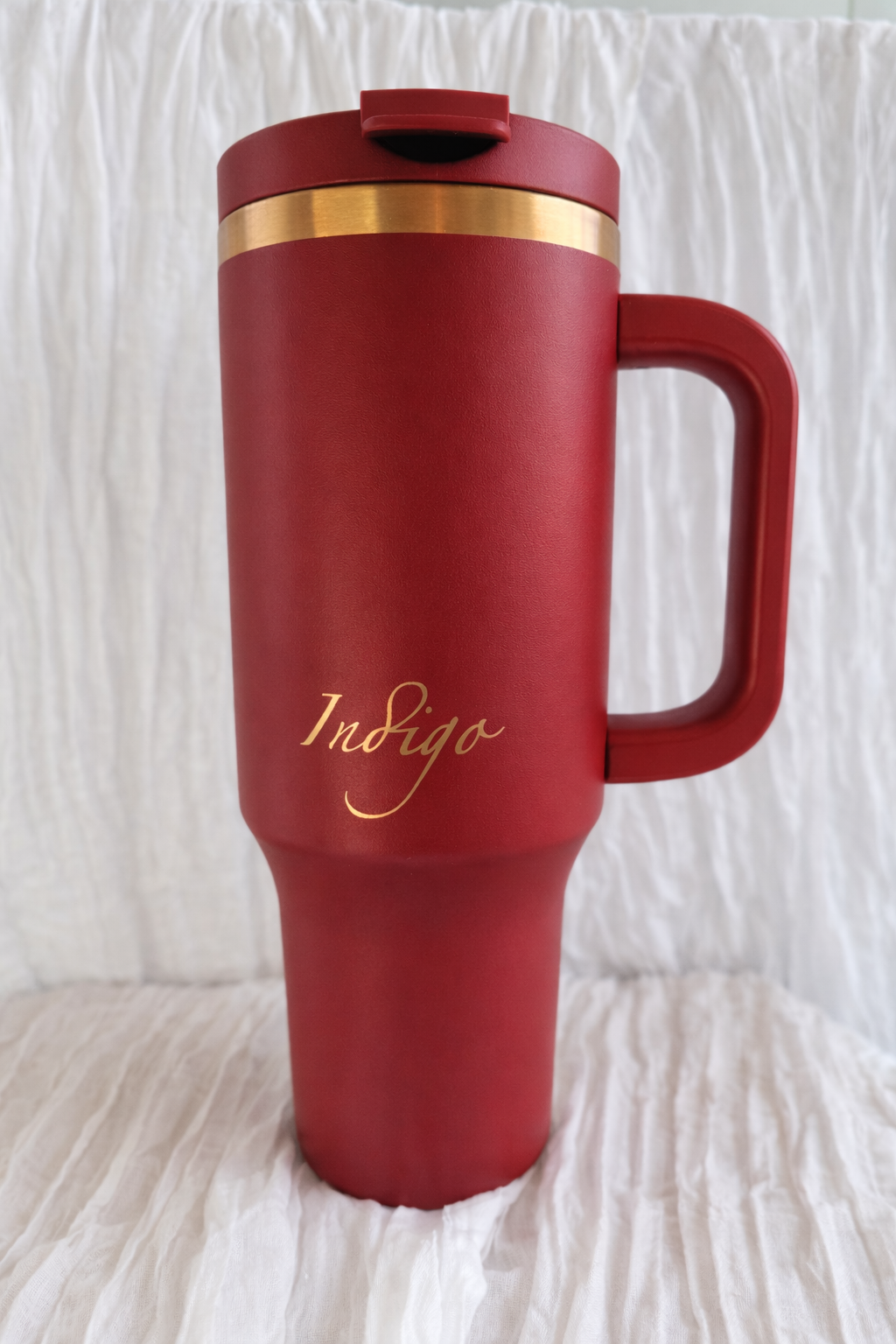 Elegant red mug with gold accents.png