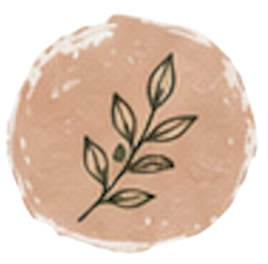 A round beige cookie with a black leaf illustration on top.