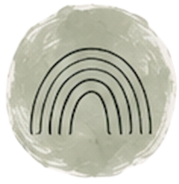 A white circular dish with a black rainbow design in the center.