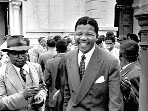 Nelson Mandela (Moses Kotane on left) at Treason Trial