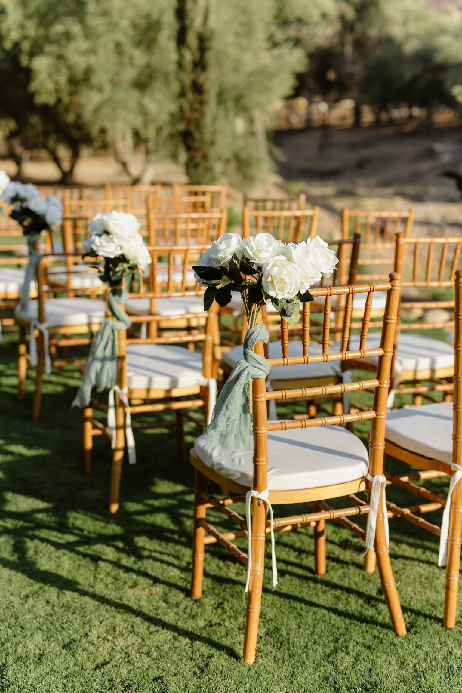 Outdoor wedding ceremony setup with white chairs at Monarca Ranch venue in Hemet CA