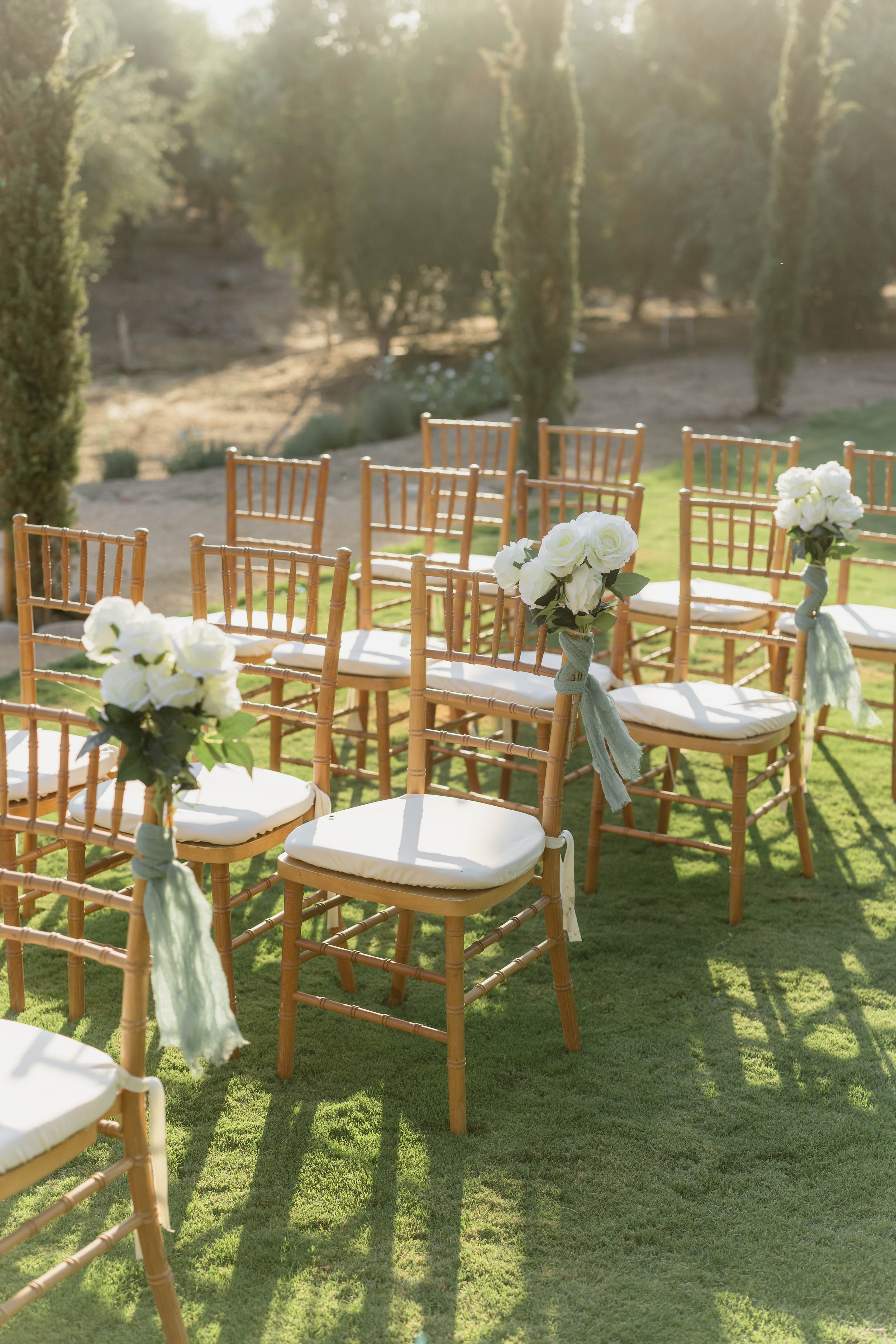 Wedding aisle with chairs and flowers setup at Monarca Ranch CA