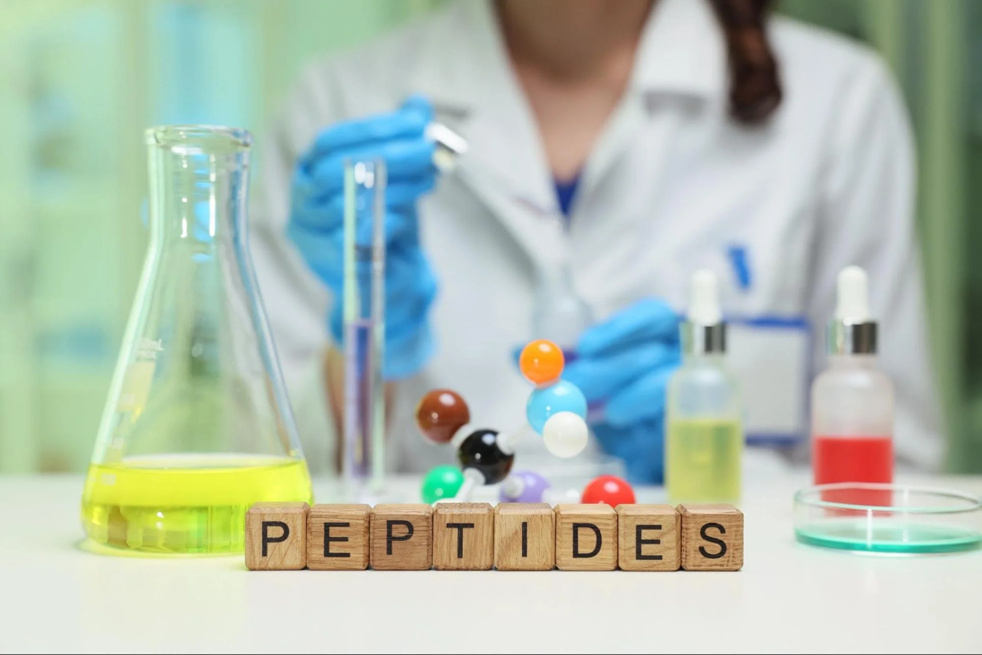 Scientist doing experiments with peptides for blog about what are peptides and which are most commonly used by Dr Jessica Knape Healthspan Internal Medicine in Boulder CO.jpg