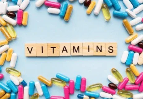 vitamins around wooden letters spelling vitamins for blog about cerebral folate deficiency and why is folinic acid important for autism mthfr and cognitive decline. Image used by Dr. Jessica Knape of HealthSpan Internal Medicine in Boulder, CO.jpg