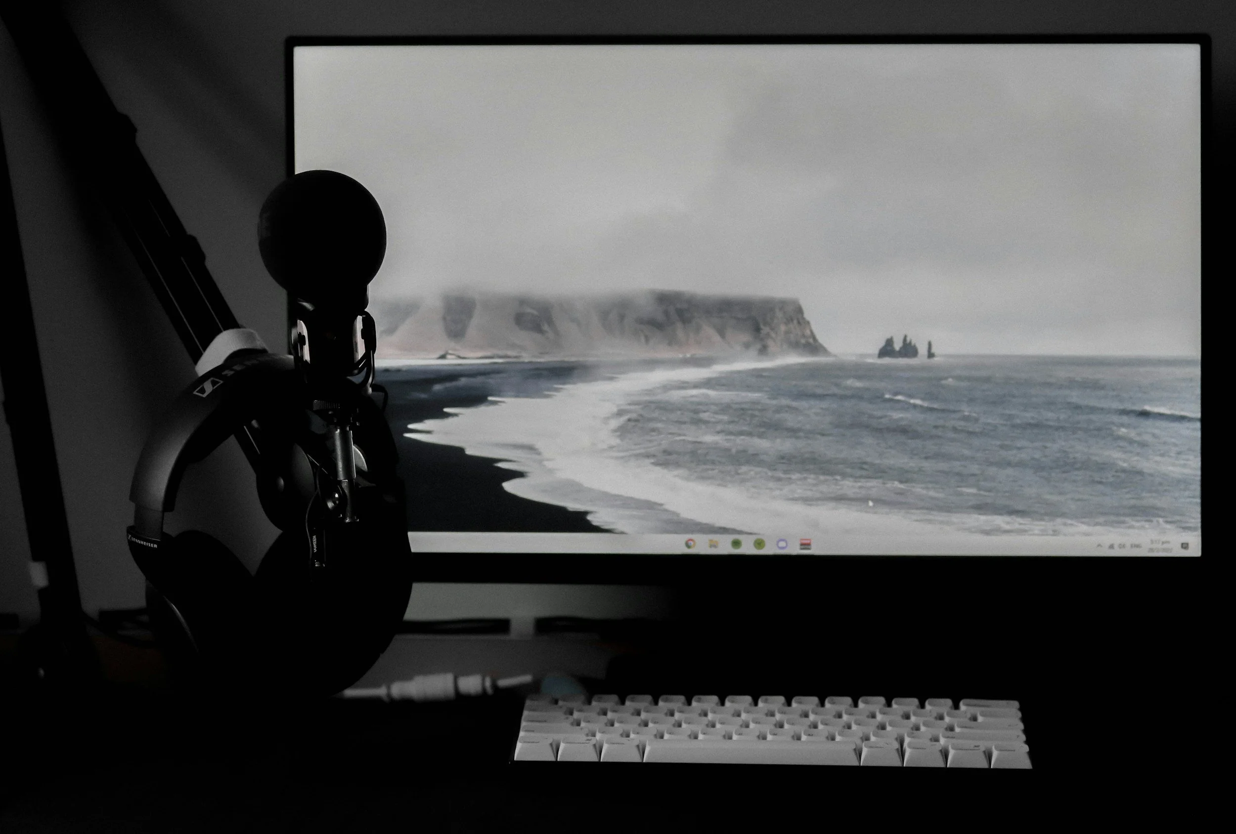 Computer screen with an ocean cliff background