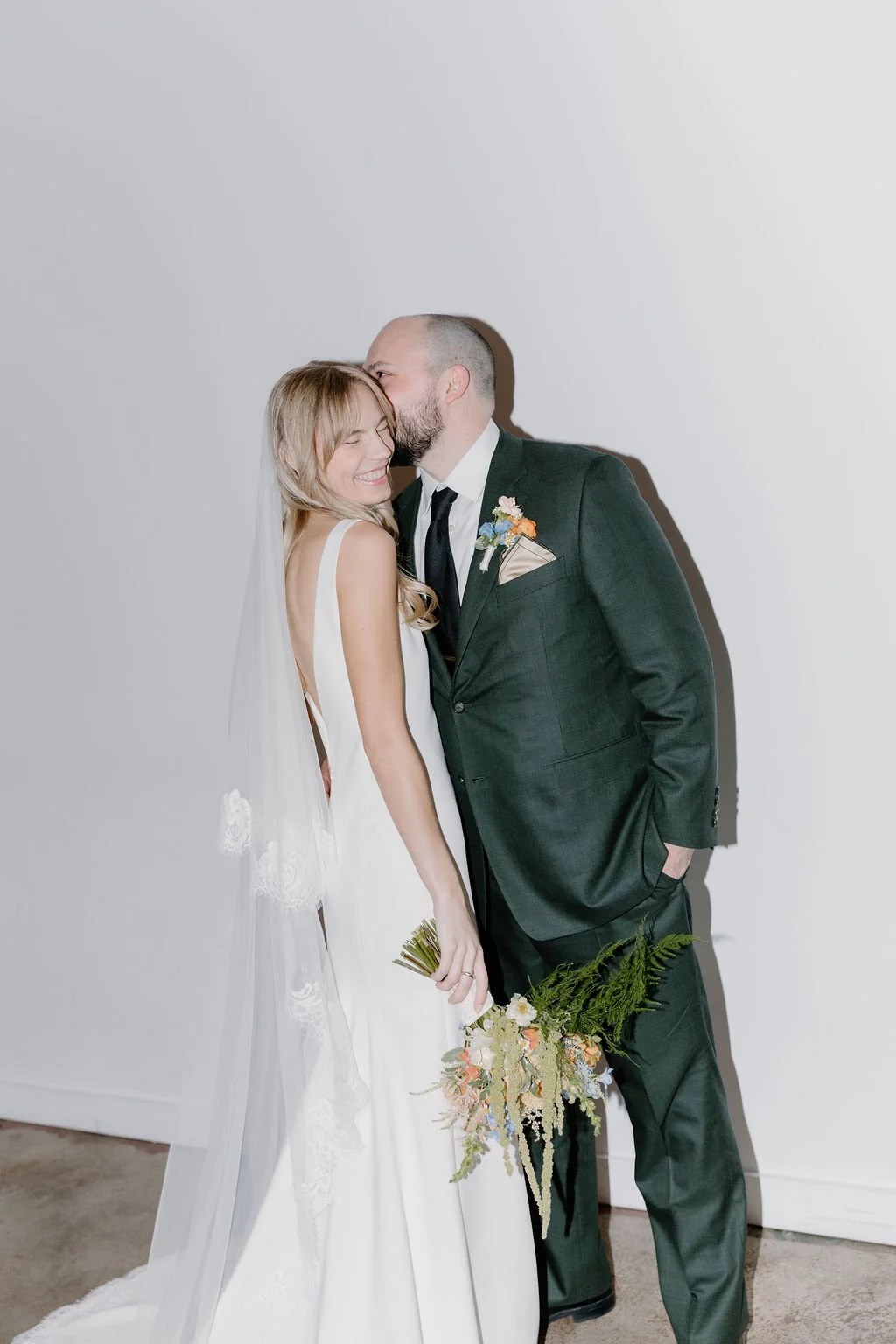 Bride and groom kissing