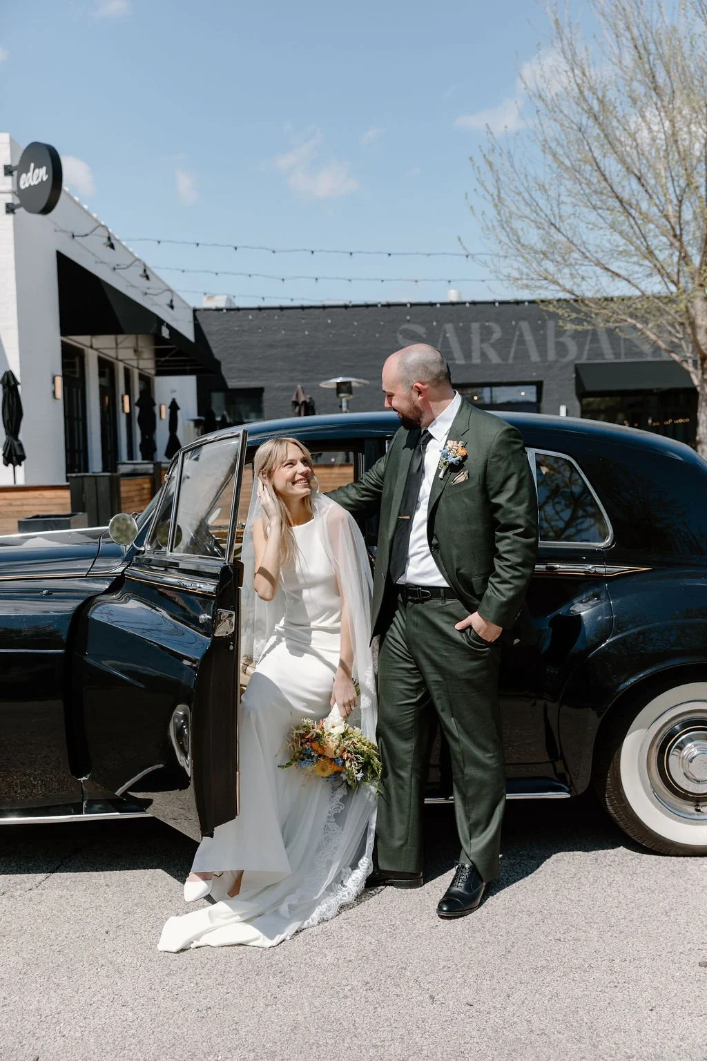 Bride and groom smiling at eachother