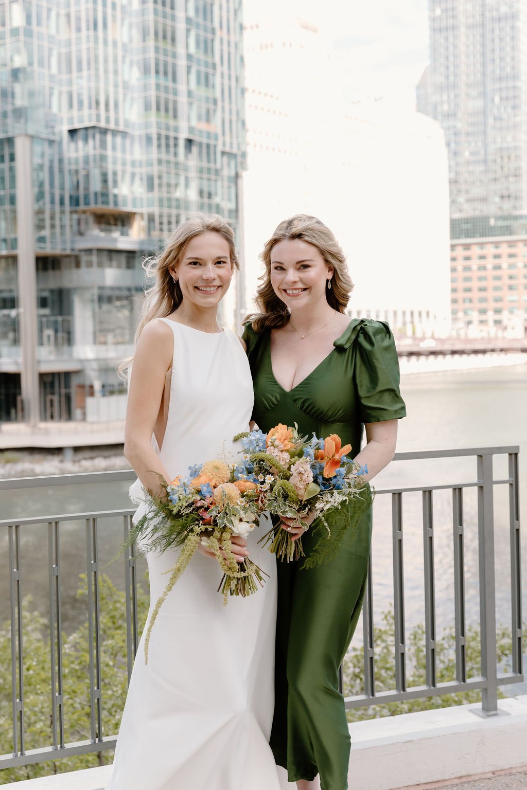 Bride with bridesmaid holding bouquets