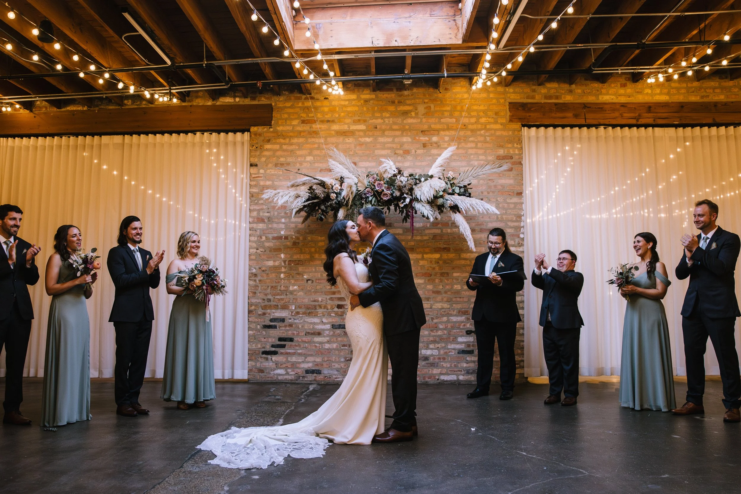 Bride and groom ceremony kiss