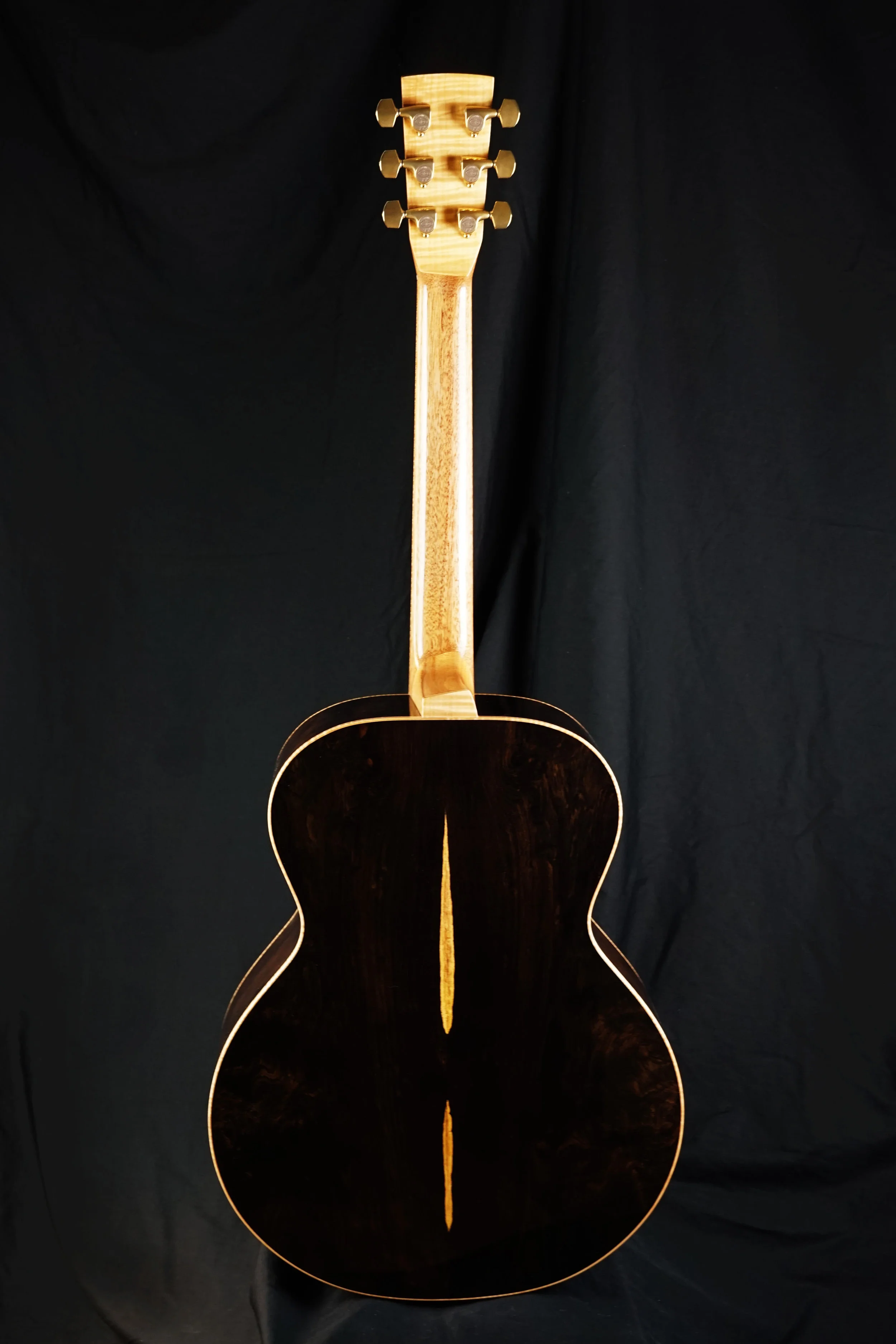 Back of a steel string guitar made from African Blackwood.
