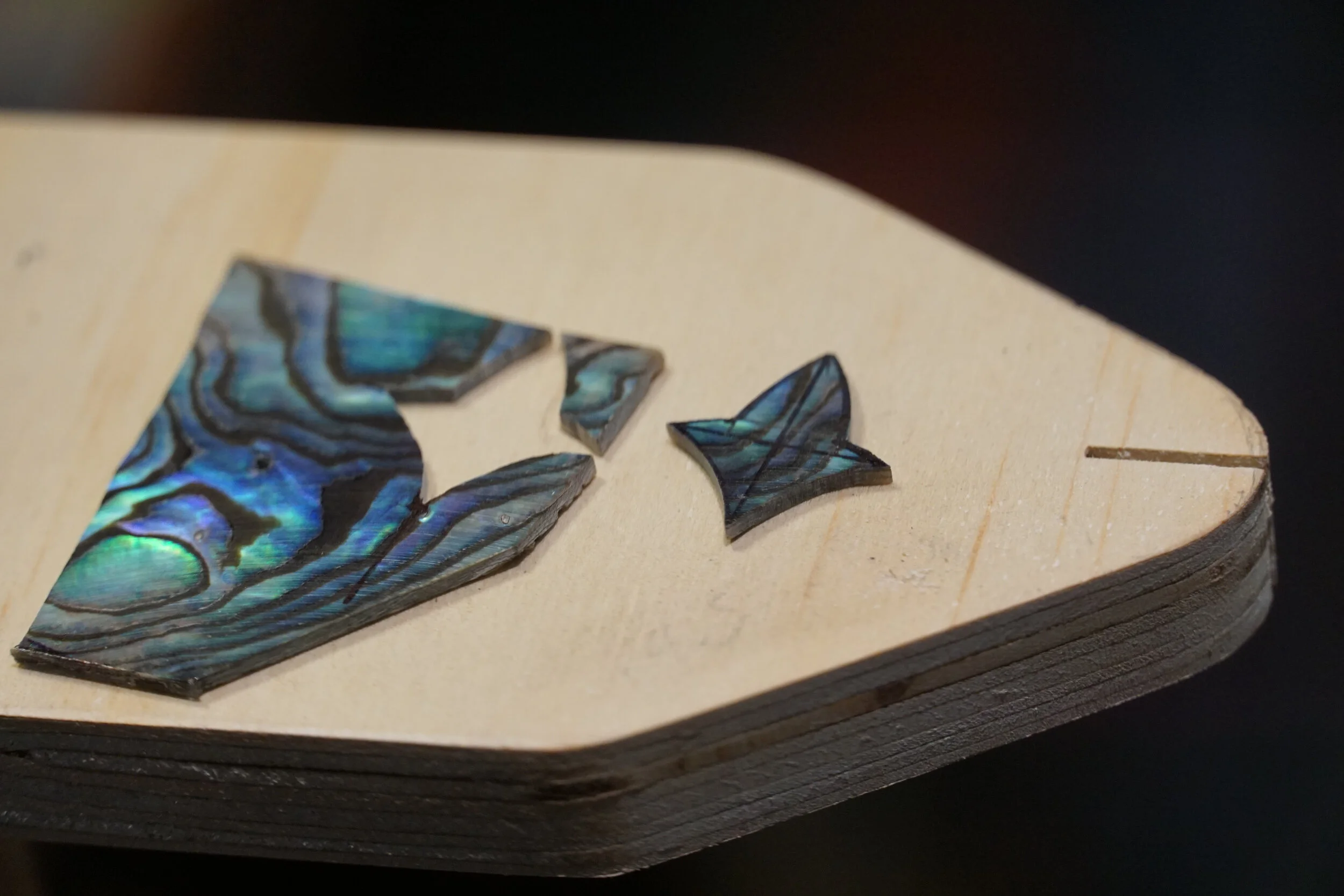 Making guitar inlay from abalone shell.