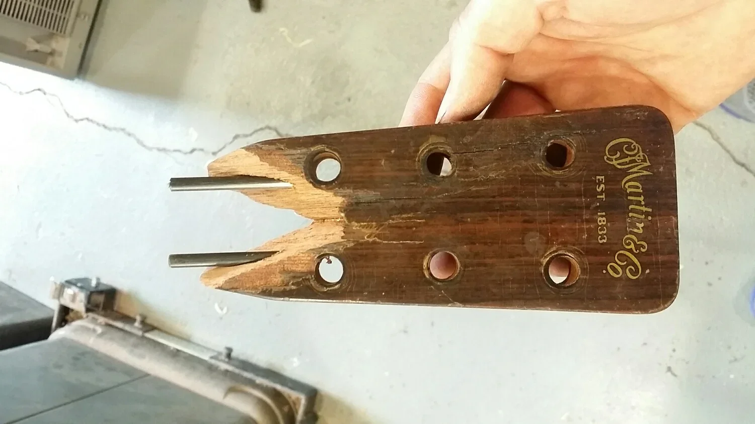 Broken Martin Headstock with two carbon rods.