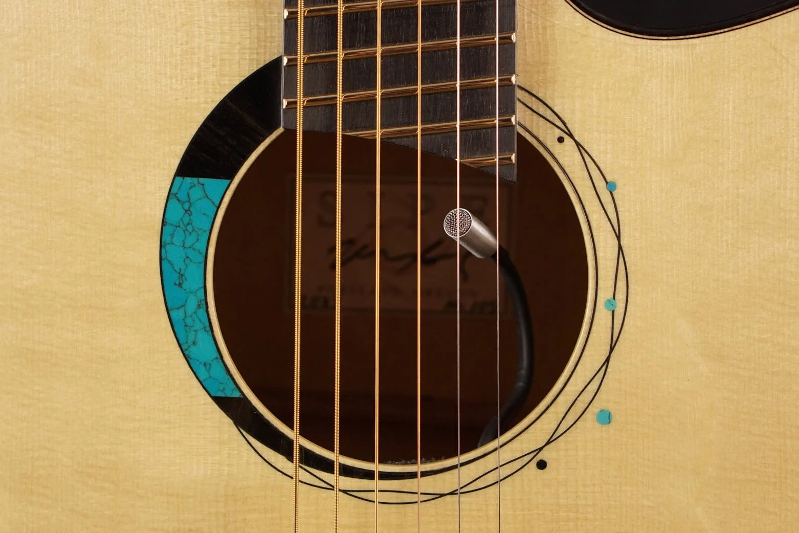 ebony and turquoise inlay on spruce
