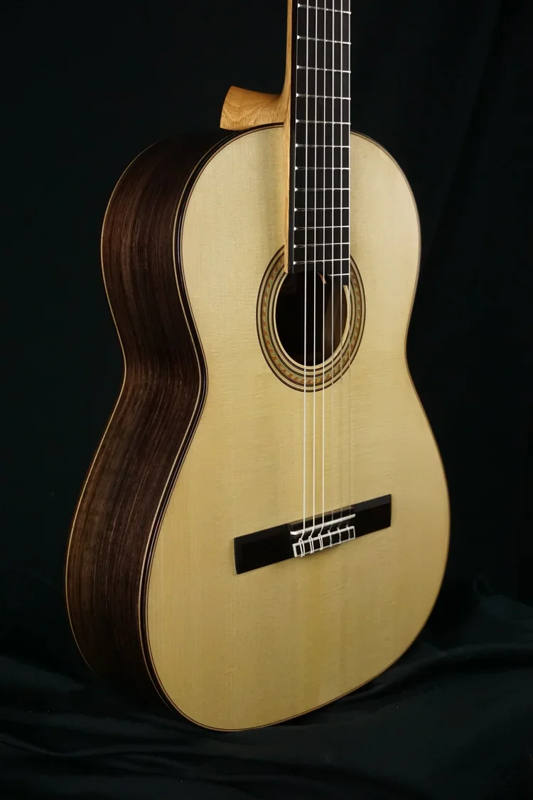 Classical Guitar East Indian rosewood / Swiss spruce 650mm scale on black background.