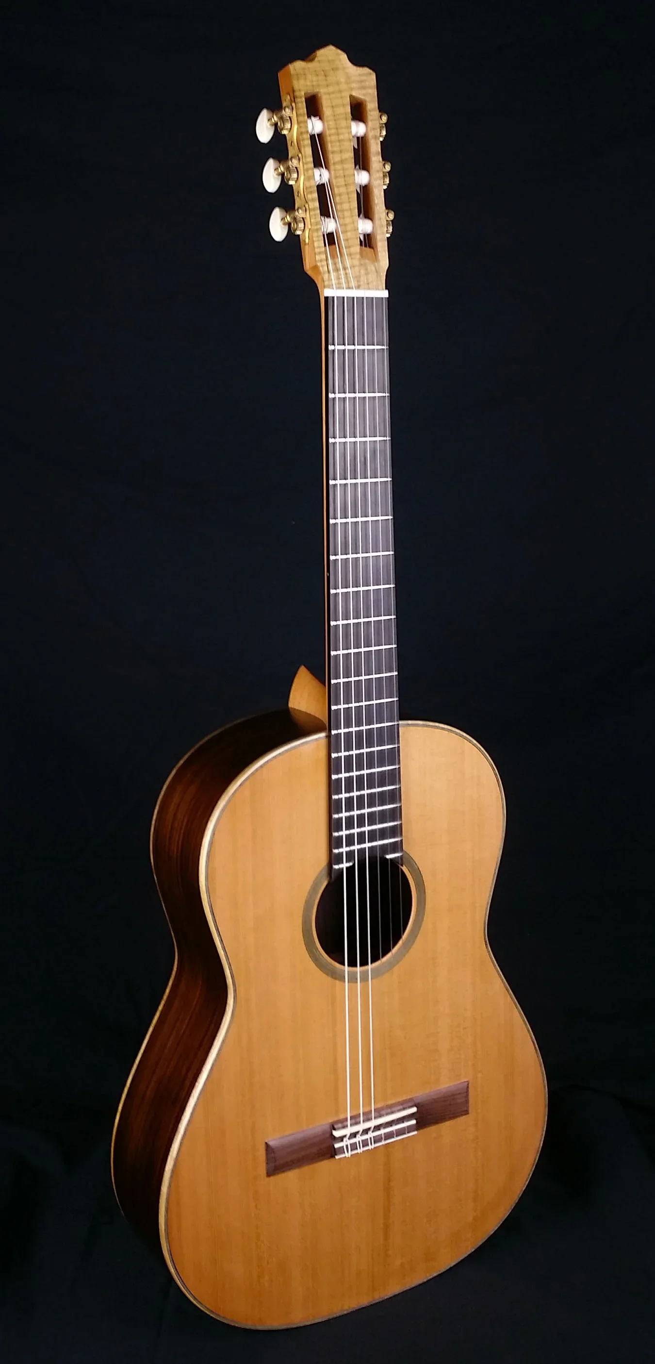 Sipe Spartan Model Classical Guitar with Cedar Top on a black background.