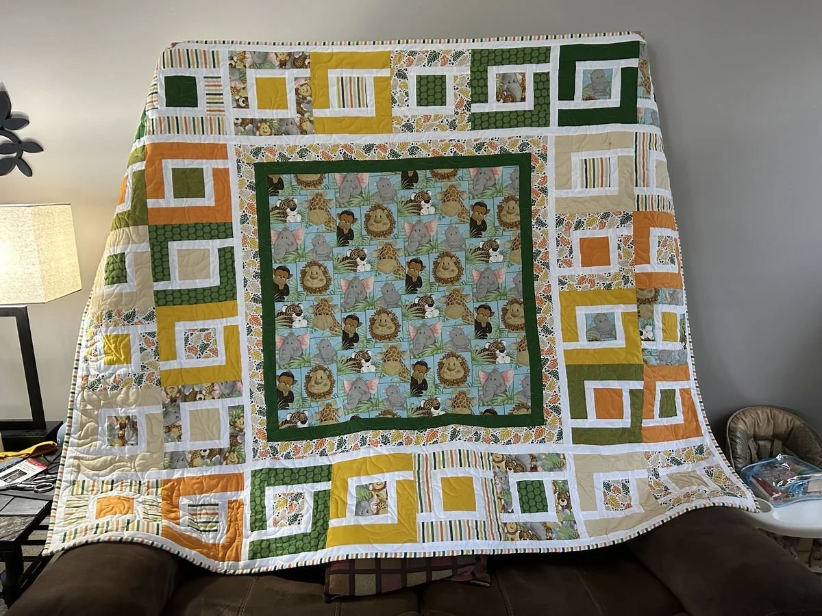 Bloomington, Illinois quilt artist, wife and mom, offering custom baby quilts, memorial quilts, wedding quilts and specialty designs shipped globally.