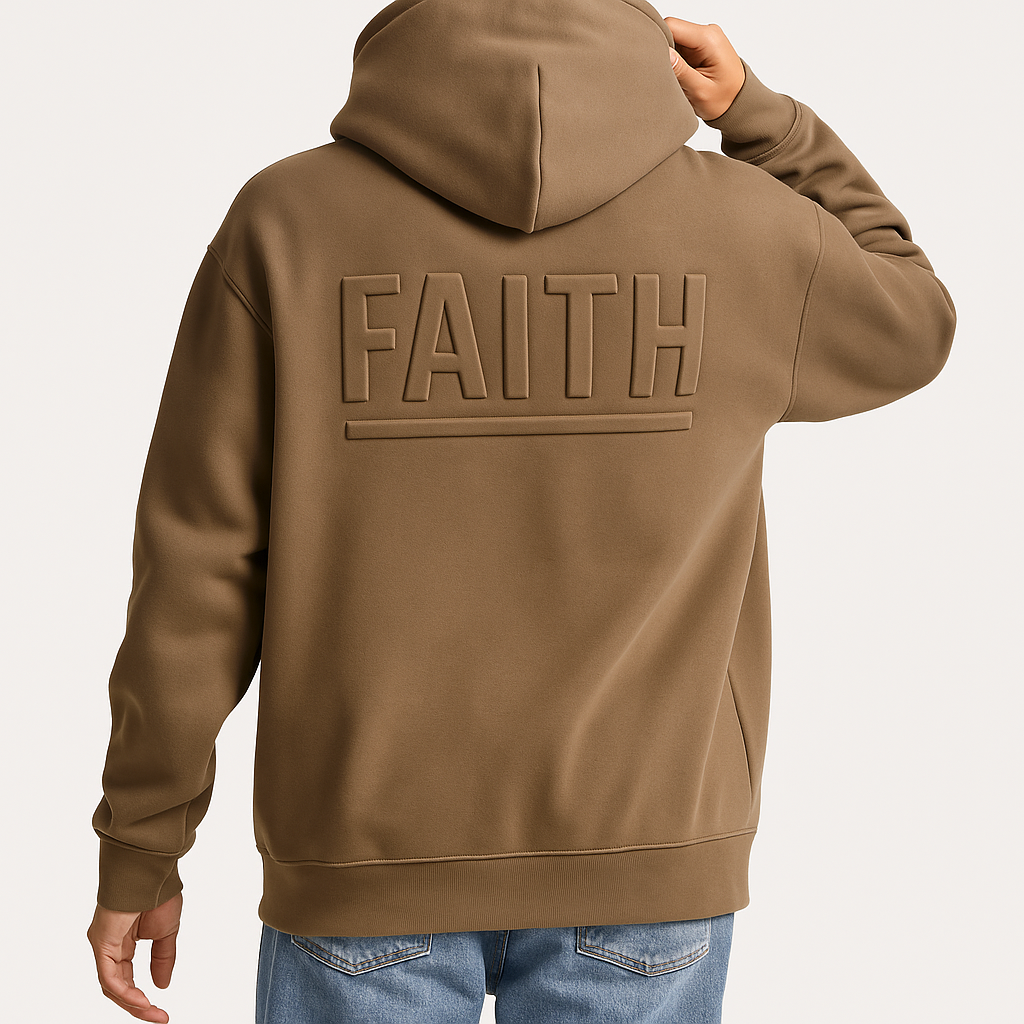 Back view of a person wearing a brown hoodie with the word "FAITH" embossed on the back in large letters.