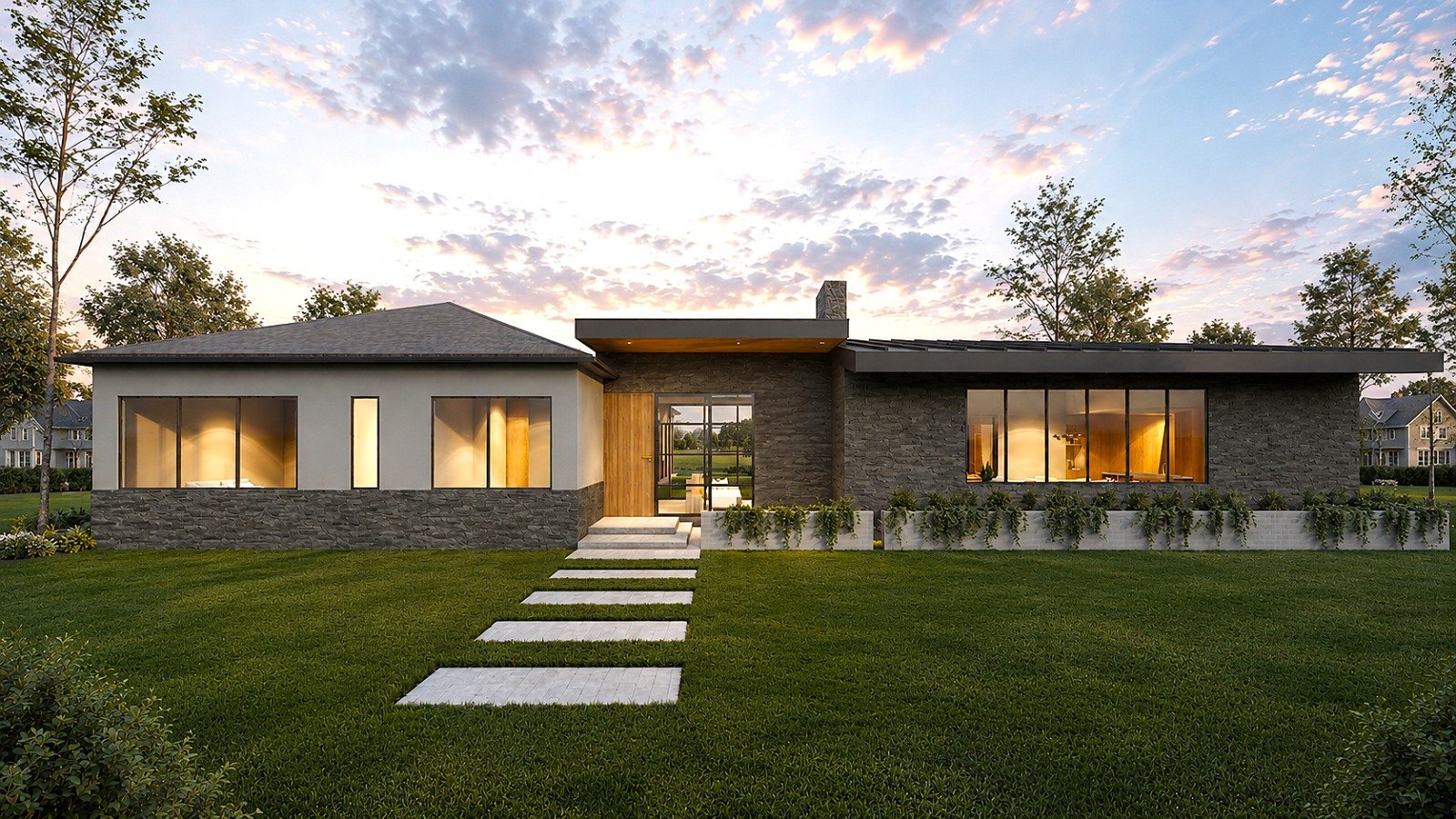 Modern single-story house with large windows, stone and wood exterior, surrounded by green lawn and trees, under a colorful sunset sky.