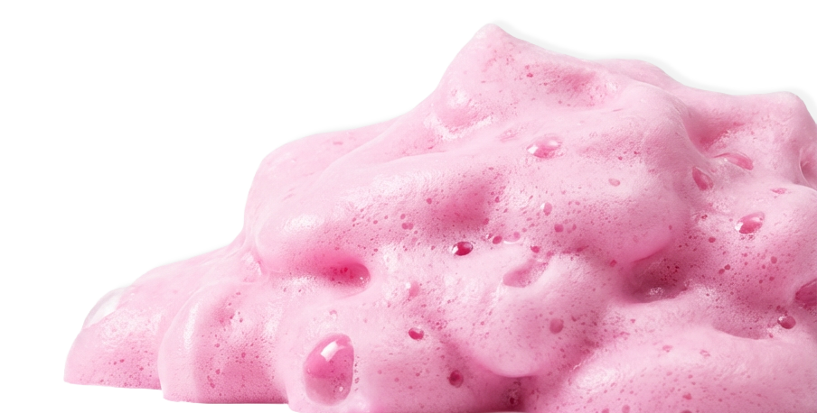 A close-up of pink, foamy, bubbly soap or foam.