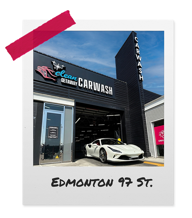 White sports car parked outside a Black Car Wash building on Edmonton 97 Street.