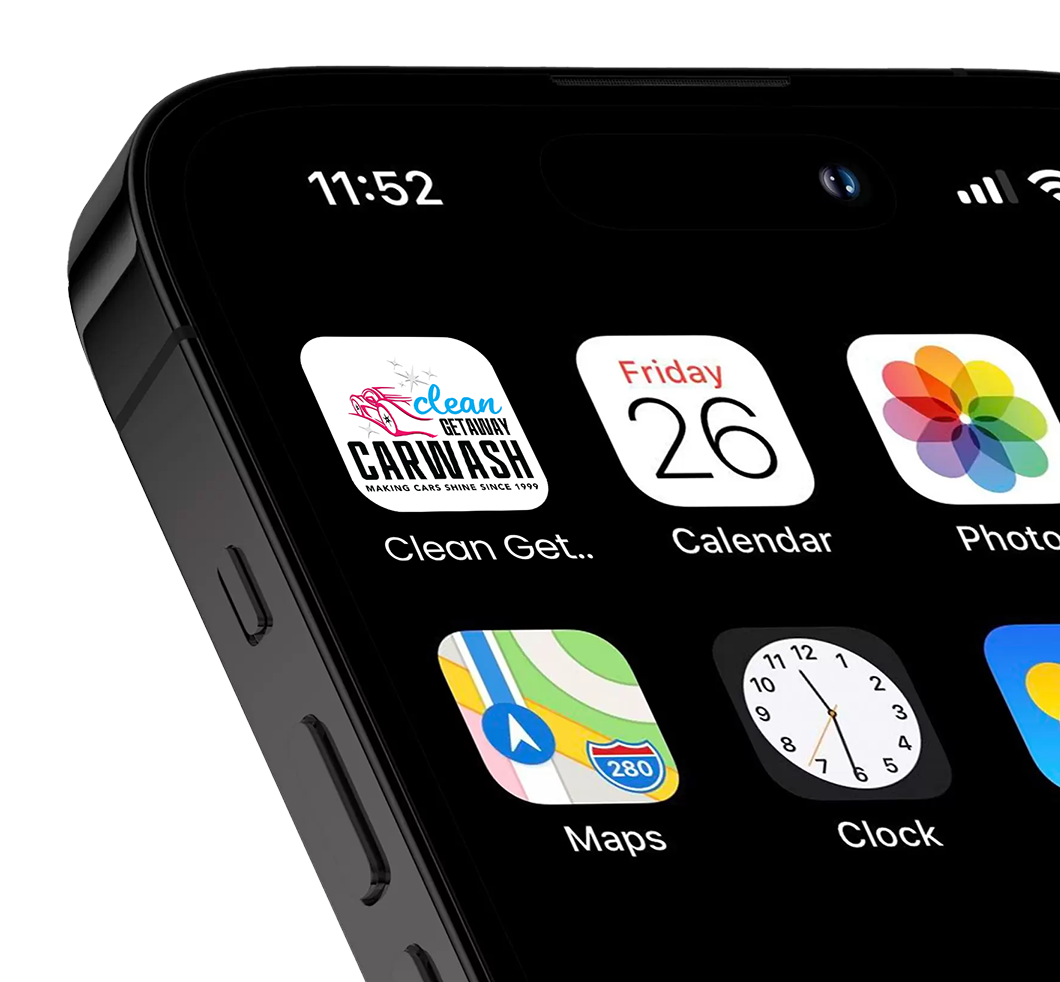 Close-up of an iPhone screen showing app icons including Clean Getaway Car Wash, Calendar, Photos, Maps, and Clock, with the time 11:52 and date Friday 26.