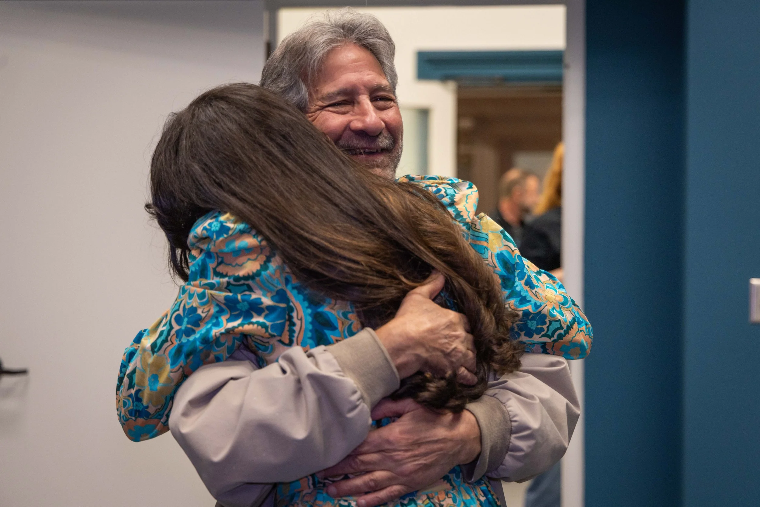 CEO Emilia Torello hugging supporter Richard Trubia at the PTPT Studio Open House on December 17, 2025.

Photographer: Riley Moore