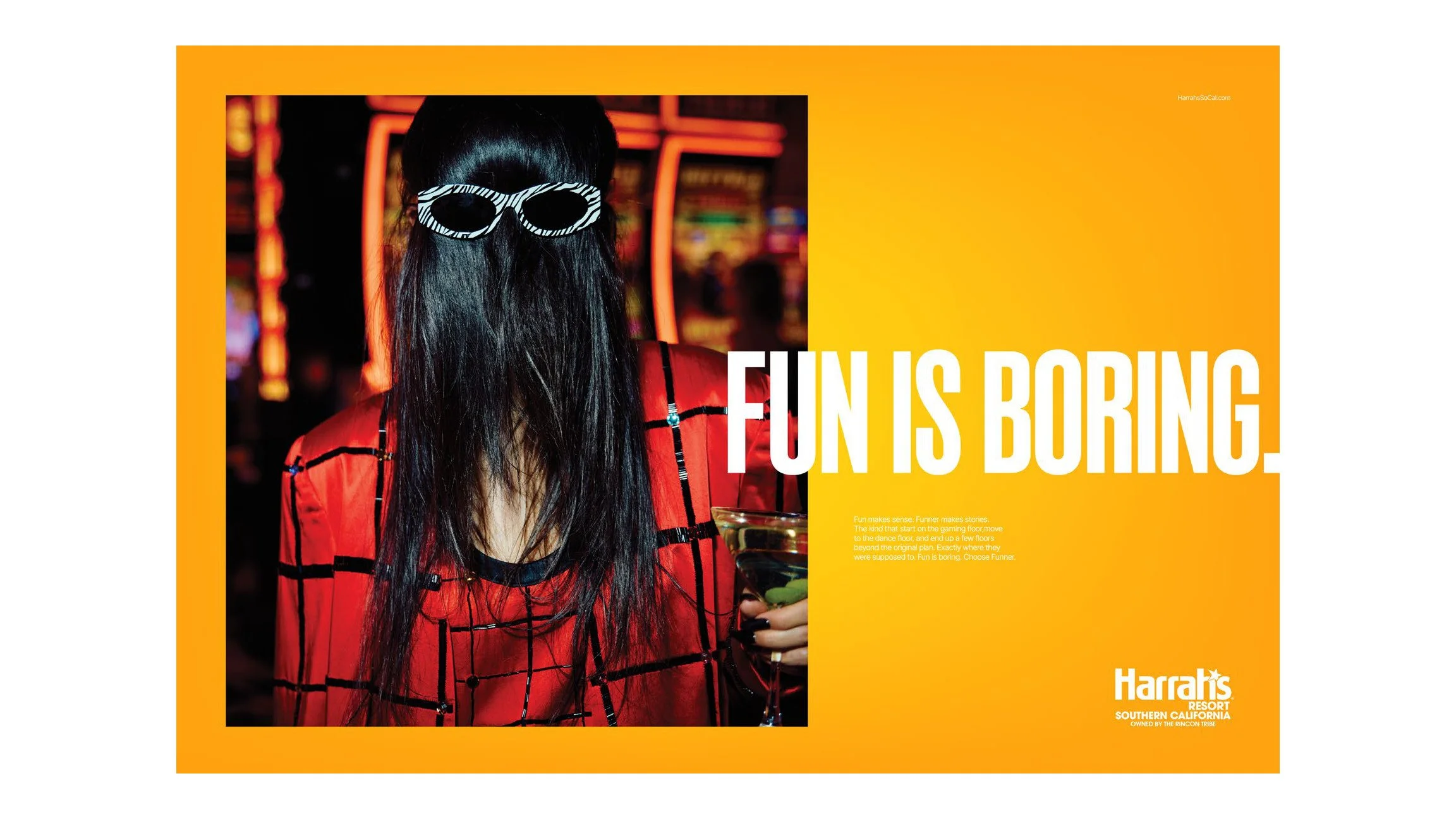 Harrah's ad "Fun is boring." with a woman's hair covering her face under sunglasses