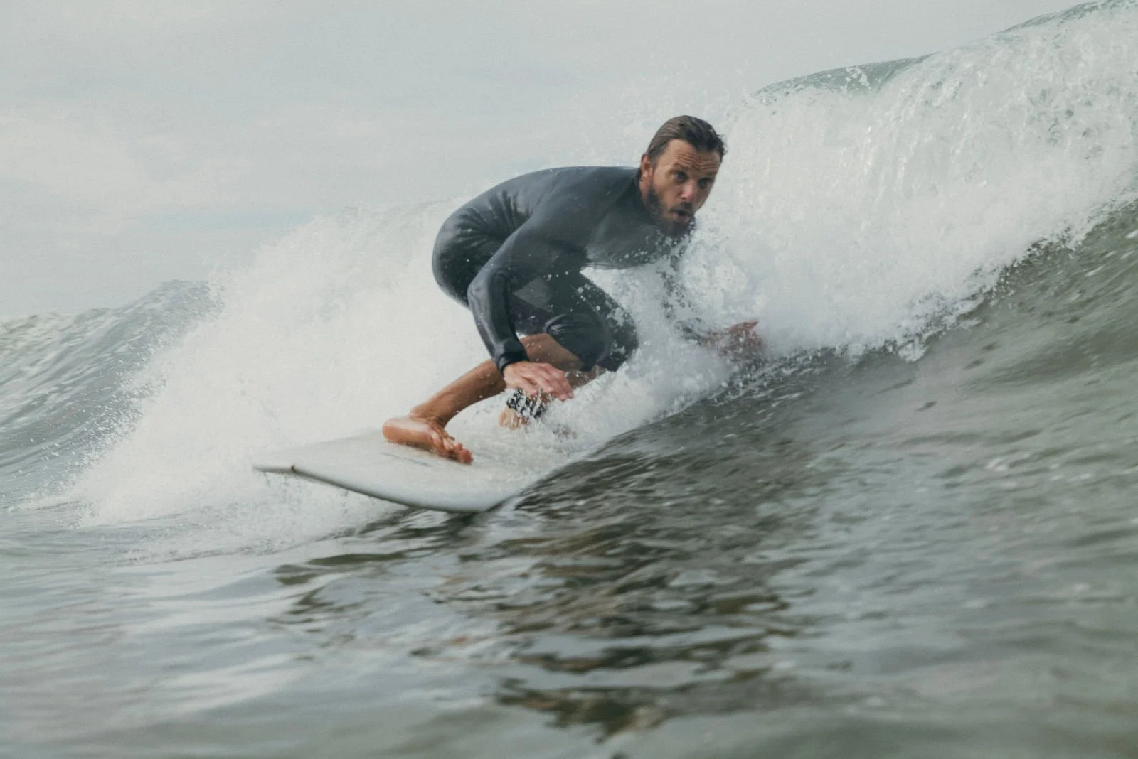 Nick surfing a wave