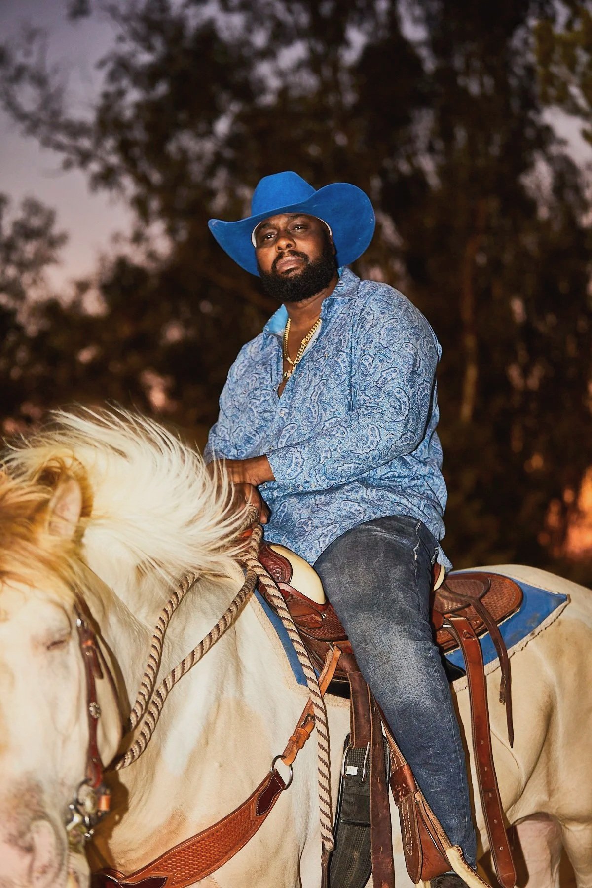 A cowboy prepares to enter the arena at the BPIR rodeo in Los Angeles by Western Photographer Gabriela Hasbun.
