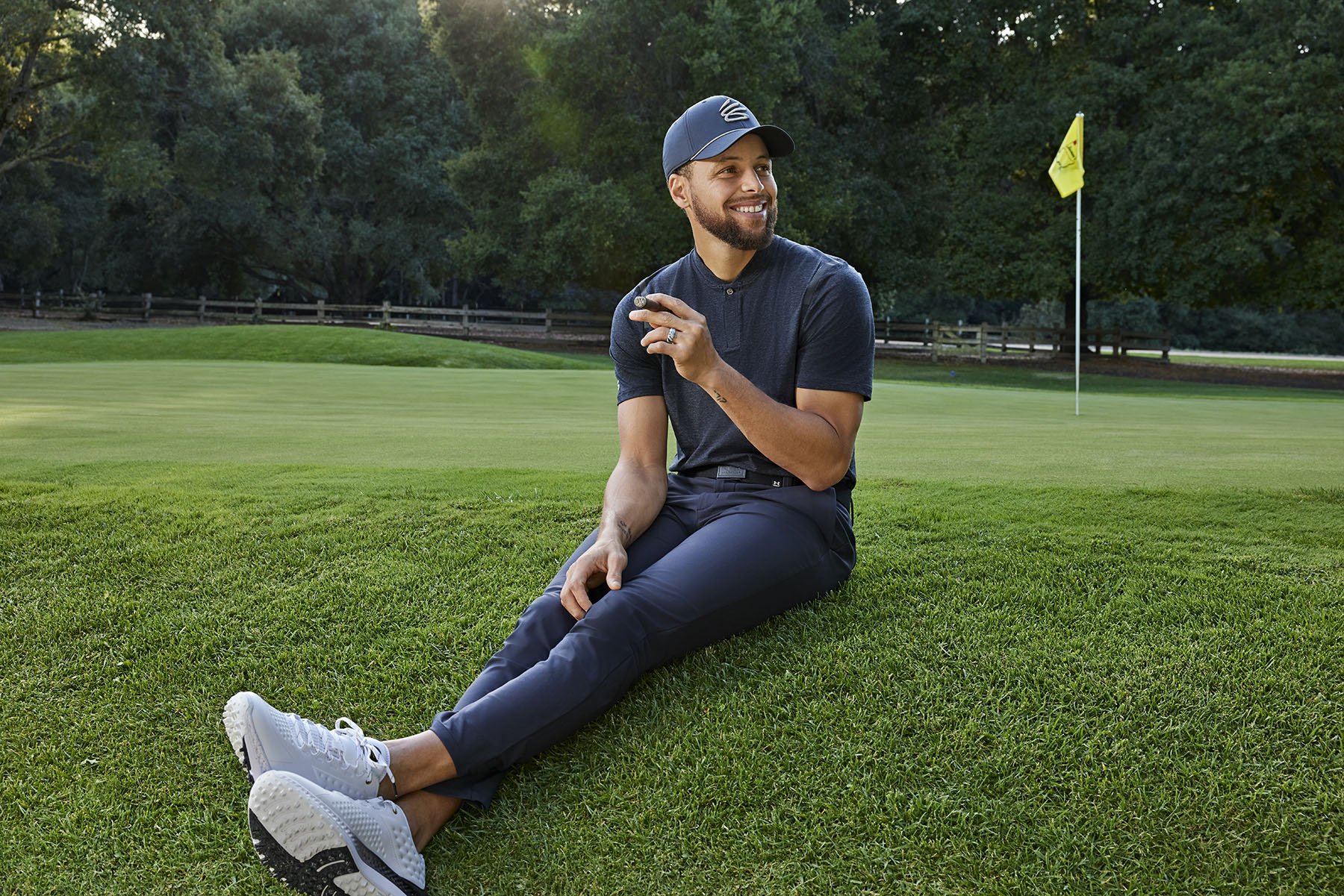 Lifestyle photograph of Stephen Curry on a golf course photographed in Silicon Valley by editorial photographer Gabriela Hasbun.