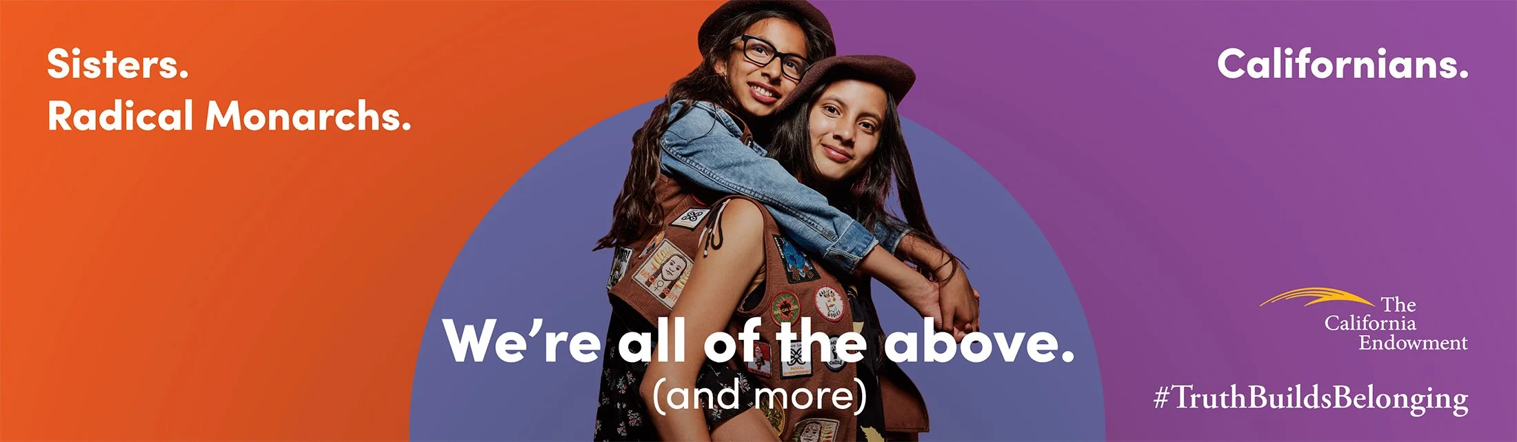 Two Latina girls in matching brown vests and berets hug in a portrait by San Francisco–based commercial photographer Gabriela Hasbun. The text promoting diversity and belonging . Shot for The California Endowment.