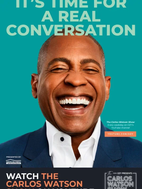 A smiling man in a suit and white shirt, promoting The Carlos Watson Show, with a teal background and text about real conversation.