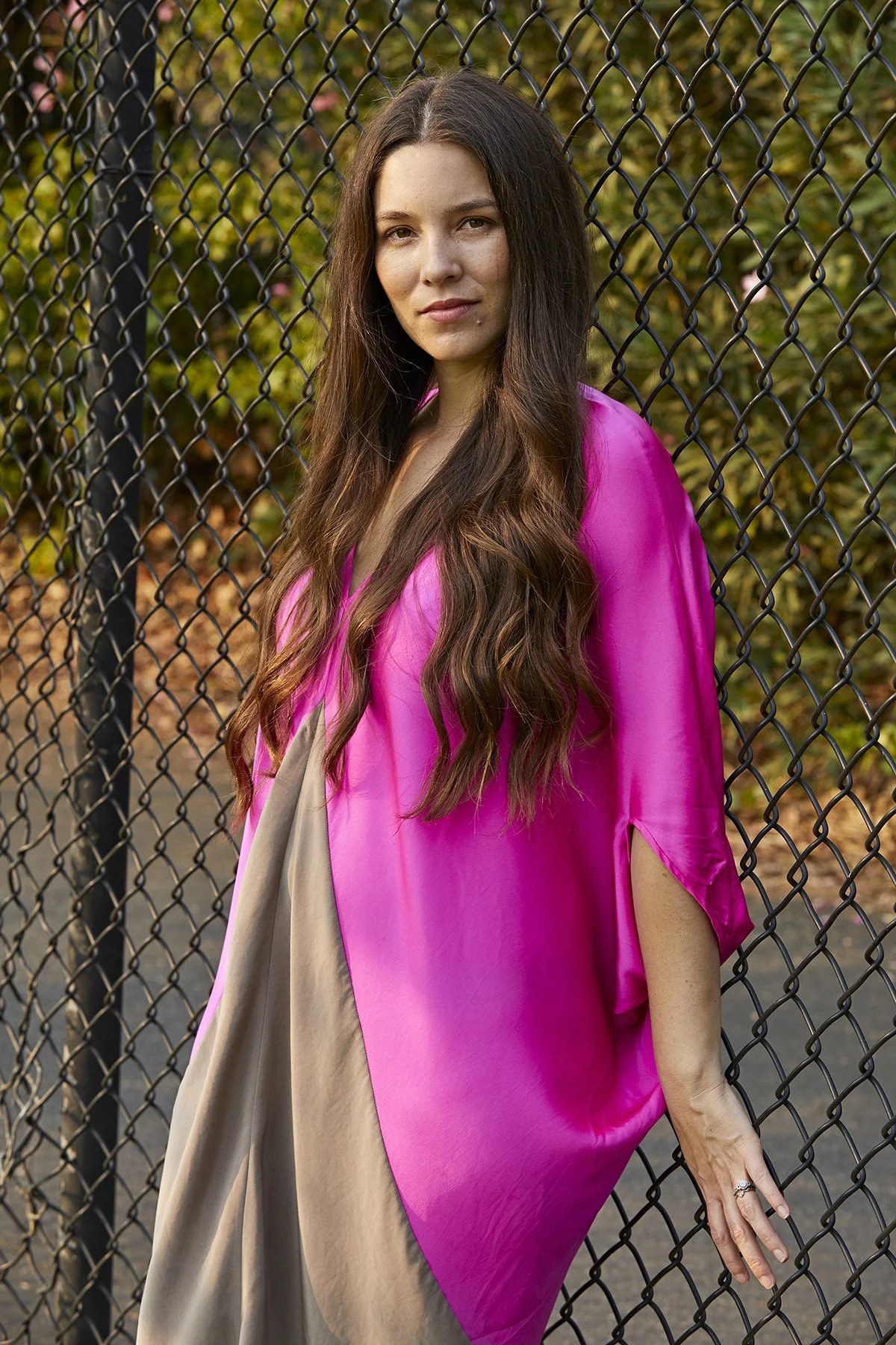 Maria Jose Palacio wears a pink dress outdoors, founder of Progeny Coffee, photographed for Inc. magazine by Gabriela Hasbun.