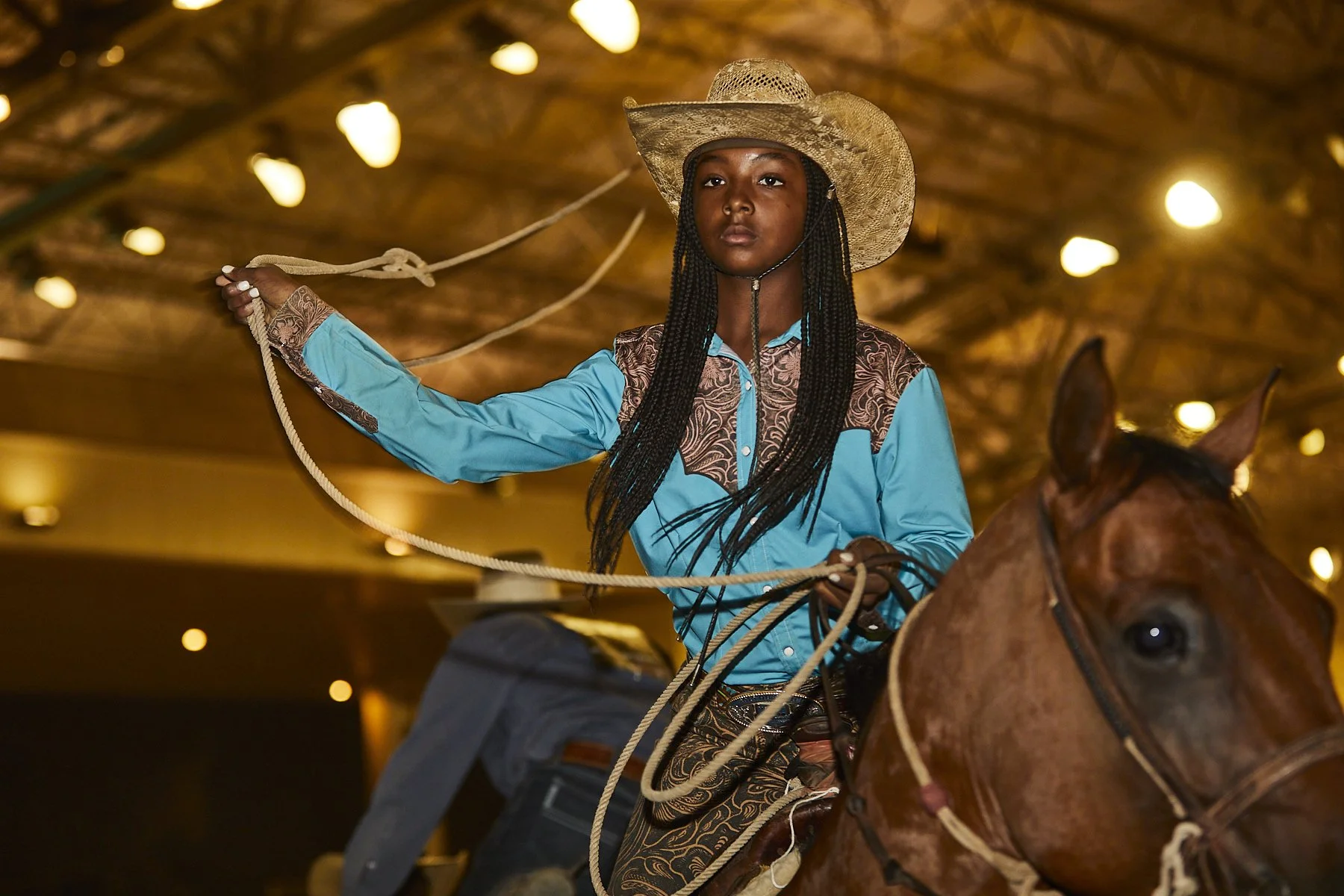 A cowboy prepares to enter the arena at the BPIR rodeo in Los Angeles by Western Photographer Gabriela Hasbun.