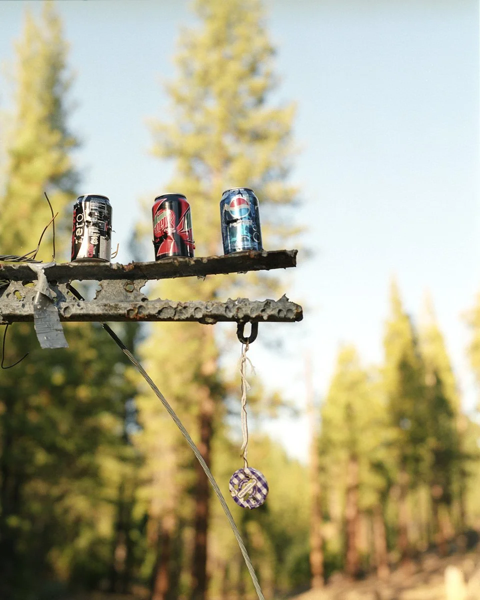 Cans at a shooting range in Indian Valley by Western Lifestyle photographer Gabriela Hasbun